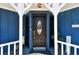 Charming home's front door, with detailed black door, sidelights, and decorative trim at 1500 Elmwood St, Clearwater, FL 33755