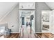 An open hallway boasts hardwood floors, neutral walls and access to the rest of the house at 1500 Elmwood St, Clearwater, FL 33755