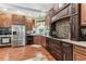 This kitchen is complete with stainless steel appliances, beautiful cabinetry, and granite countertops at 1500 Elmwood St, Clearwater, FL 33755