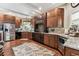 Modern kitchen with granite countertops, stainless steel appliances, and custom cabinets providing ample storage space at 1500 Elmwood St, Clearwater, FL 33755