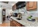 Cozy kitchenette area with a granite countertop, and views to a dining area at 1500 Elmwood St, Clearwater, FL 33755