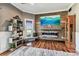 Bright living area with hardwood floors, fireplace, and charming decor at 1500 Elmwood St, Clearwater, FL 33755
