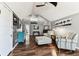 Inviting living room featuring hardwood floors, neutral furniture, a ceiling fan and plenty of natural light at 1500 Elmwood St, Clearwater, FL 33755