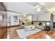 Bright and open living room features hardwood floors and a comfortable sectional sofa at 1500 Elmwood St, Clearwater, FL 33755