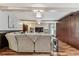 Spacious living room with exposed beams, wood floors, and large built-in cabinets at 1500 Elmwood St, Clearwater, FL 33755