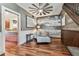 Comfortable living room with hardwood floors, staircase, and easy access to kitchen at 1500 Elmwood St, Clearwater, FL 33755