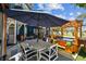 Inviting patio features a dining table, hot tub, and comfortable seating, perfect for relaxing outdoors at 1500 Elmwood St, Clearwater, FL 33755