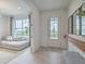 Inviting entryway with a view into the living room and a bright front door at 17130 Moonflower Dr, Venice, FL 34293