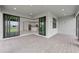Covered outdoor patio with brick pavers, recessed lighting, and sliding glass doors to the home's interior at 17200 Luminous Ave, Venice, FL 34293