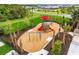 Bright and colorful community playground with slides, swings, and ample space for children to play and explore at 17200 Luminous Ave, Venice, FL 34293