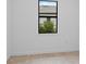 White room with window showing tree at 17200 Luminous Ave, Venice, FL 34293