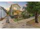Charming two-story home with a well-maintained lawn and a welcoming front porch behind a black fence at 1816 E 15Th Ave, Tampa, FL 33605