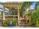 Inviting front porch with comfortable seating, decorative plants, and a stylish ceiling fan at 1816 E 15Th Ave, Tampa, FL 33605