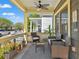 Comfortable front porch with stylish seating, potted plants, and a view of the neighborhood at 1816 E 15Th Ave, Tampa, FL 33605