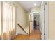 Second floor hallway with hardwood floors and neutral paint at 1816 E 15Th Ave, Tampa, FL 33605