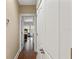 Hallway view to bedroom with wood floors and large white linen closet at 1816 E 15Th Ave, Tampa, FL 33605