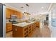 Spacious kitchen with granite countertops, custom cabinets, and stainless steel appliances at 1816 E 15Th Ave, Tampa, FL 33605
