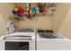 Updated laundry room features modern washer and dryer units at 1816 E 15Th Ave, Tampa, FL 33605