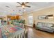 Spacious room featuring a guitar, couch, dining table, and an adjacent kitchen at 1816 E 15Th Ave, Tampa, FL 33605