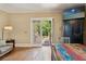 Cozy room with dining table, chairs, and a sliding glass door that leads to the backyard at 1816 E 15Th Ave, Tampa, FL 33605