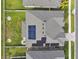 An aerial view of a house with solar panels, showing the roof and surrounding landscape at 19316 Eagle Creek Ln, Tampa, FL 33647