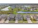 Aerial view of houses with ponds, landscaping, and community layout at 19316 Eagle Creek Ln, Tampa, FL 33647