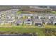 Panoramic aerial view of homes with ponds, fenced backyards, and lush greenery at 19316 Eagle Creek Ln, Tampa, FL 33647
