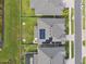 Aerial shot of a home featuring solar panels, well-maintained landscaping, and a view of the neighborhood at 19316 Eagle Creek Ln, Tampa, FL 33647