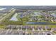 Aerial view of a neighborhood featuring well-manicured lawns, ponds, and attractive single-Gathering homes at 19316 Eagle Creek Ln, Tampa, FL 33647