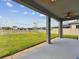 Large, well-maintained backyard features lush lawn, white fence, and young trees, offering ample space for recreation at 19316 Eagle Creek Ln, Tampa, FL 33647