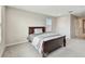 Cozy bedroom featuring a simple wooden frame bed and a peaceful ambiance at 19316 Eagle Creek Ln, Tampa, FL 33647