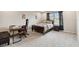 Comfortable bedroom with a desk, large bed, and soft lighting for a relaxing ambiance at 19316 Eagle Creek Ln, Tampa, FL 33647