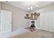 Neutral bedroom with small altar with pictures, closet, and window at 19316 Eagle Creek Ln, Tampa, FL 33647