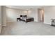 Spacious bedroom with neutral walls, plush carpet, and a comfortable bed, offering a relaxing retreat at 19316 Eagle Creek Ln, Tampa, FL 33647
