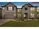Beautiful two-story home with stone accents, a well-manicured lawn, and a two-car garage at 19316 Eagle Creek Ln, Tampa, FL 33647