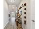 Grand hallway with wood-look tile floors, decorative garlands, and high ceilings, leading to the front door at 19316 Eagle Creek Ln, Tampa, FL 33647
