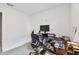 Bright home office features modern desk with computer, rolling chair, and neutral decor, creating an ideal workspace at 19316 Eagle Creek Ln, Tampa, FL 33647