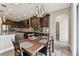 Eat-in kitchen with stainless steel appliances, granite countertops, a breakfast bar, and a view to the bathroom at 19316 Eagle Creek Ln, Tampa, FL 33647