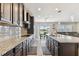 Bright kitchen offering stainless steel appliances, granite countertops, and seamless flow into the living area at 19316 Eagle Creek Ln, Tampa, FL 33647
