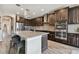 Spacious kitchen with stainless steel appliances, granite countertops, and a large center island with bar seating at 19316 Eagle Creek Ln, Tampa, FL 33647