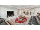 Bright, open living area with a large sectional, television, and a decorative rug at 19316 Eagle Creek Ln, Tampa, FL 33647