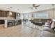 Open-concept living space with a kitchen featuring a center island, a dining area, and a comfortable seating area at 19316 Eagle Creek Ln, Tampa, FL 33647