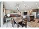 Open-concept living space with kitchen island, dining area, and spacious seating, perfect for entertaining at 19316 Eagle Creek Ln, Tampa, FL 33647