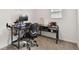 Home office featuring a computer desk with shelves and rolling chair at 19316 Eagle Creek Ln, Tampa, FL 33647