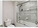 Bathroom featuring a tiled shower with glass doors and a rainfall shower head at 19316 Eagle Creek Ln, Tampa, FL 33647
