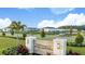 The Townhomes at River Landing entrance sign with landscaping at 2204 Paravane Way, Wesley Chapel, FL 33543