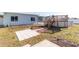 Backyard view of the home and above-ground pool at 22465 Lewiston Ave, Port Charlotte, FL 33952