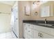 Bathroom vanity featuring granite countertops and cabinet space at 22465 Lewiston Ave, Port Charlotte, FL 33952