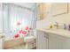 Bathroom featuring a shower/tub combo and neutral vanity at 22465 Lewiston Ave, Port Charlotte, FL 33952