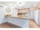 Bright kitchen featuring wooden cabinets, granite countertops, and modern appliances at 22465 Lewiston Ave, Port Charlotte, FL 33952